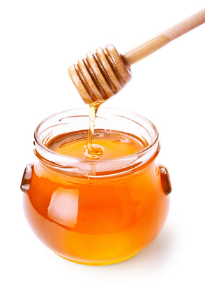 Glass jar of honey